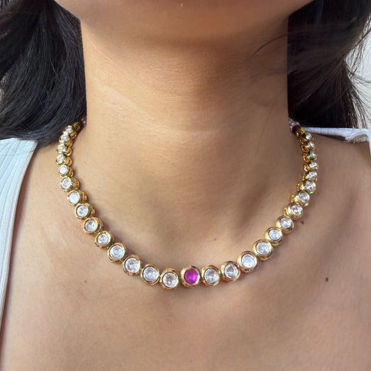 AD Kundan necklace with ruby center stone and gold finish